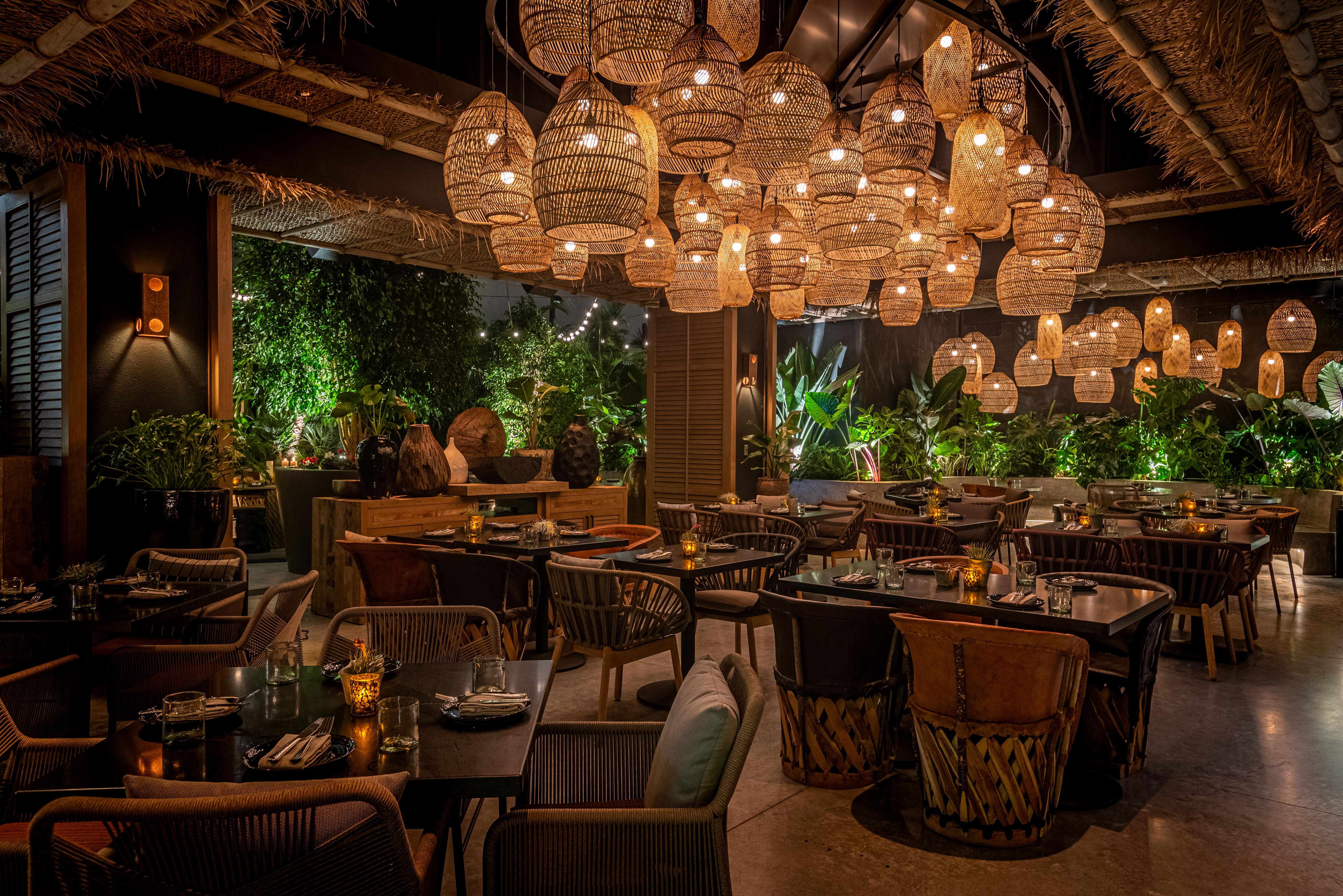 Woven chandelier installed in a luxury resort restaurant with contemporary natural architecture.