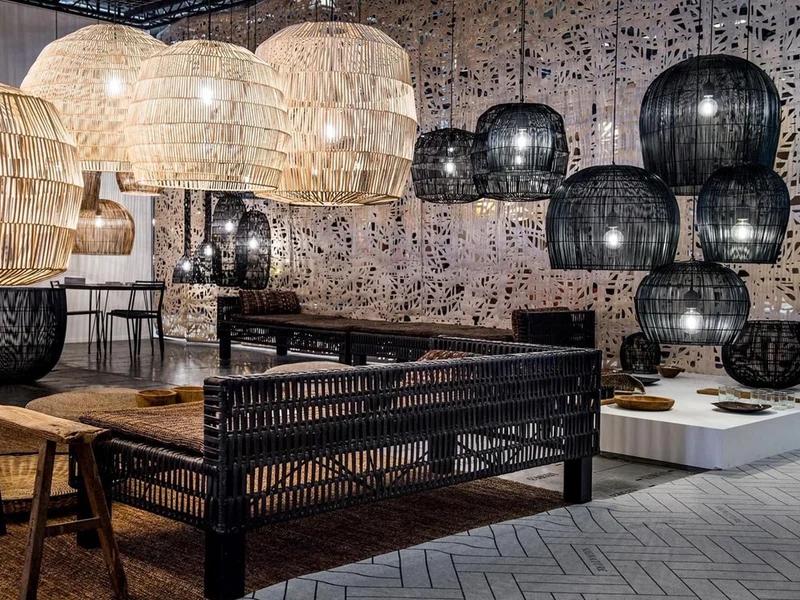 Woven chandelier installed in a luxury resort restaurant with contemporary natural architecture.