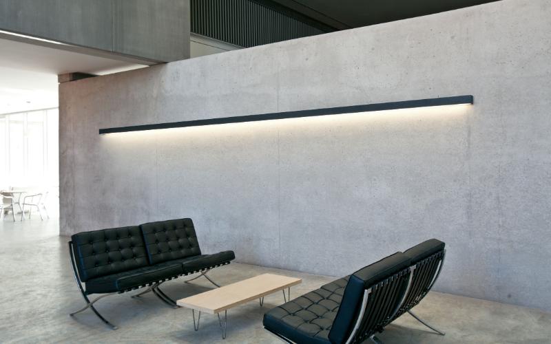 Wall-mounted linear lights installed in a contemporary hospitality interior.