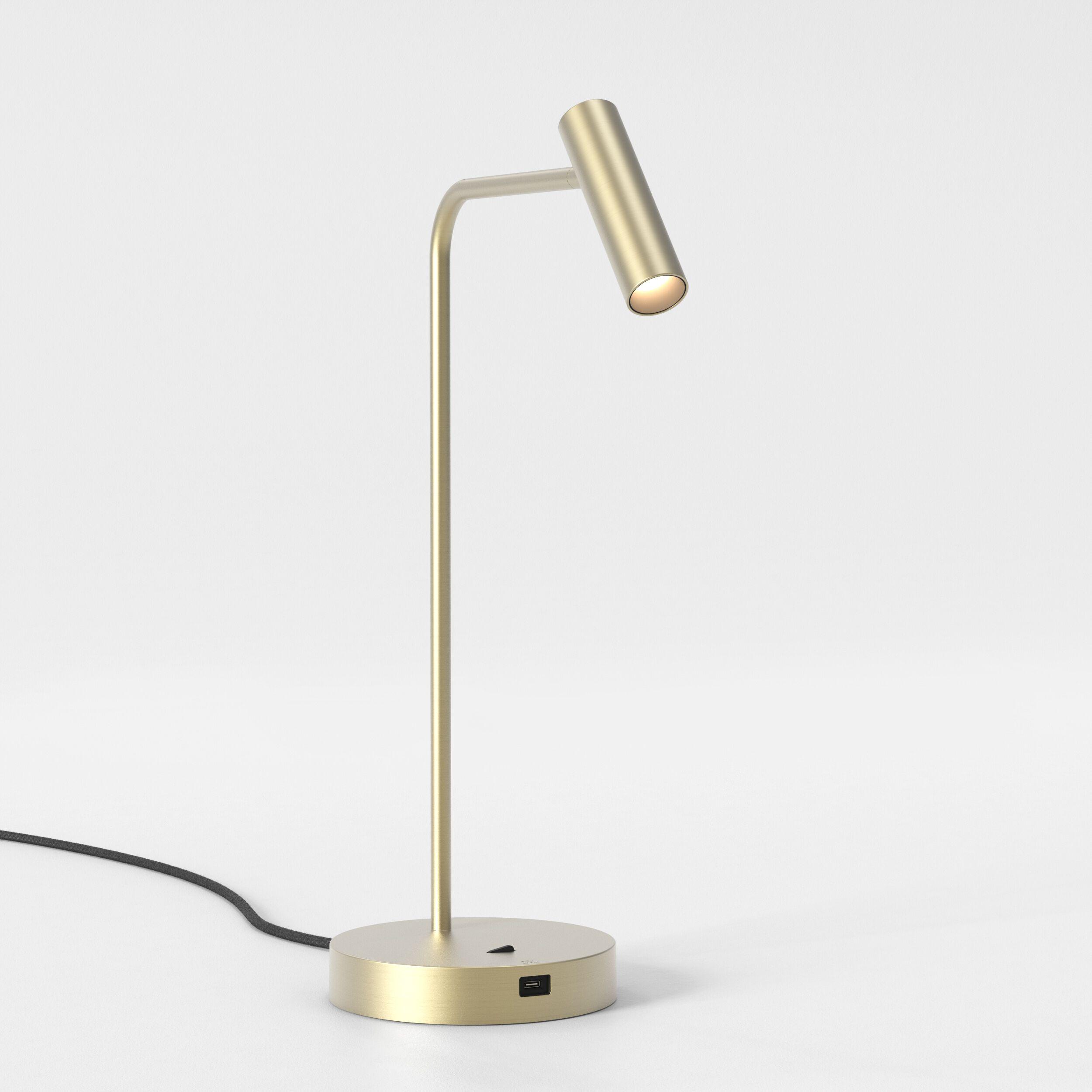 Front view of a reading table lamp highlighting its directional light head and elegant contemporary styling.