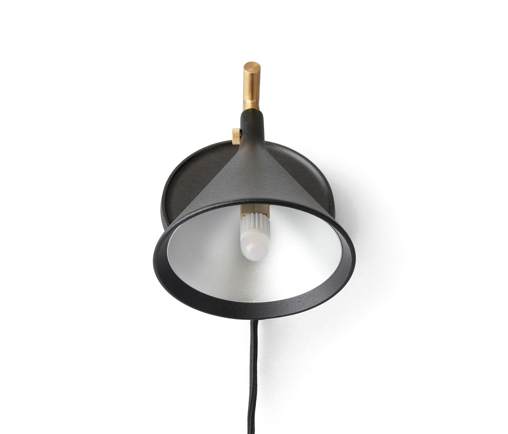 Scandinavian wall lamp photographed on a clean white studio background featuring minimalist Nordic design.