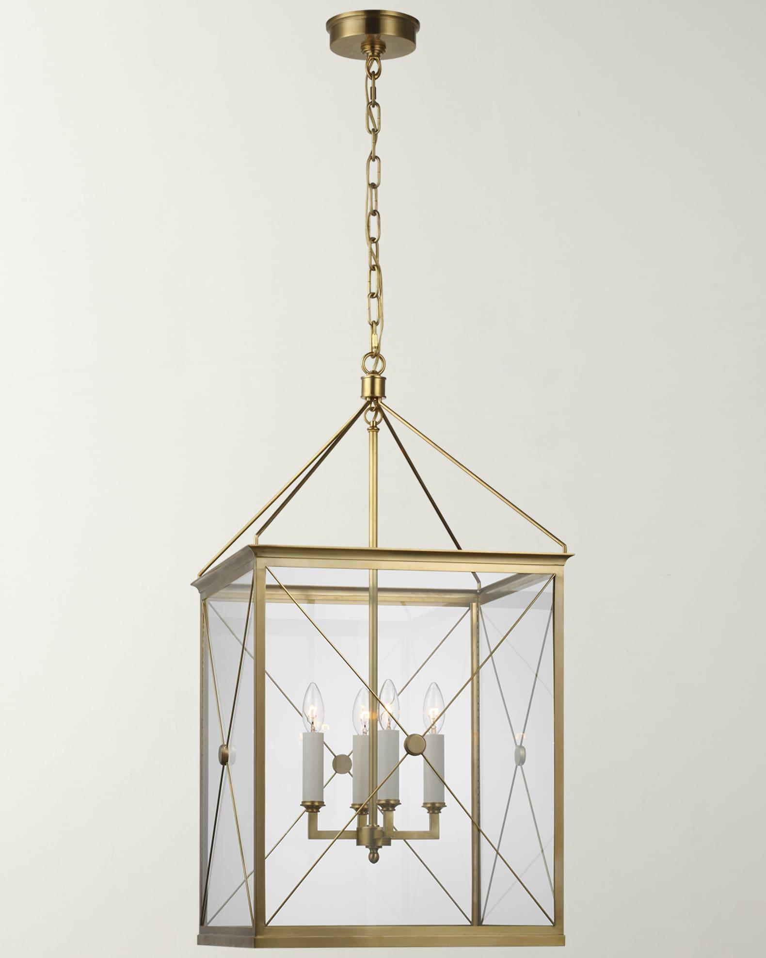 Front view of a geometric lantern chandelier with refined metal framing.