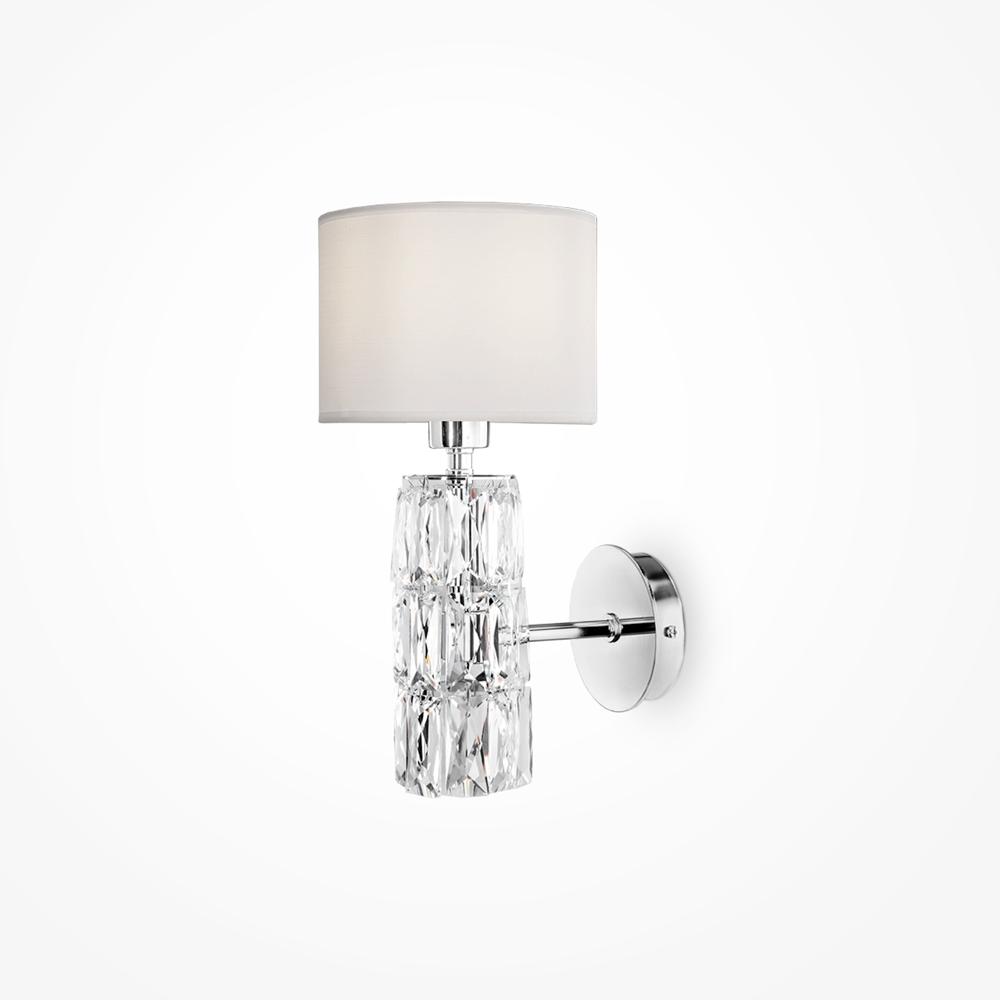 Luxury wall lamp photographed on a clean white studio background featuring premium materials and refined detailing.