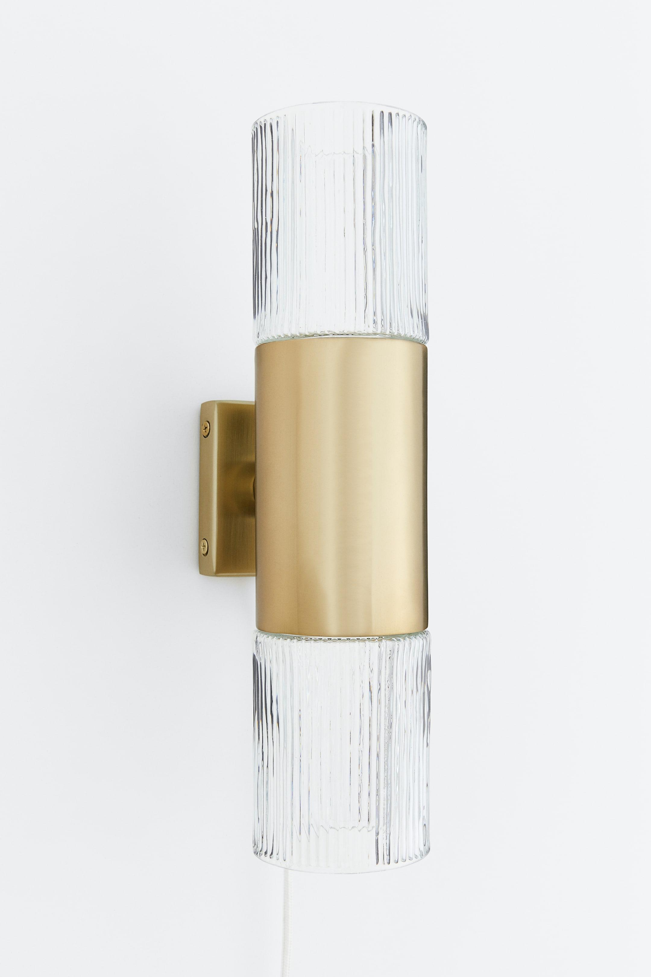 Front view of a luxury decorative wall lamp with elegant architectural proportions.