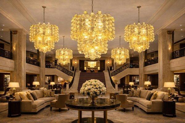 Murano chandelier installed in a luxury hospitality interior with refined architectural styling.