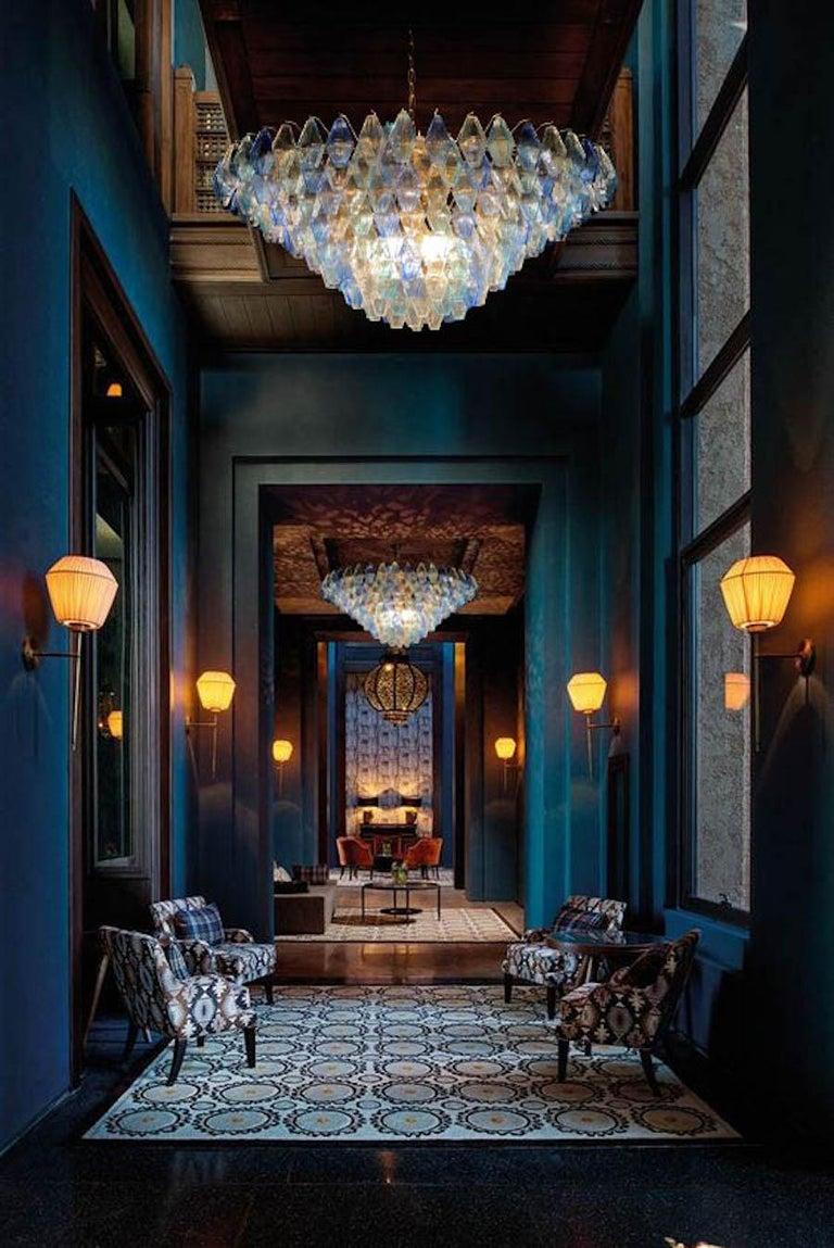 Murano chandelier installed in a luxury hospitality interior with refined architectural styling.