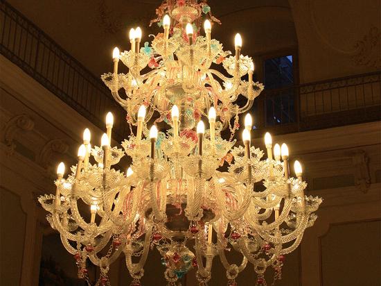 Murano chandelier installed in a luxury hospitality interior with refined architectural styling.