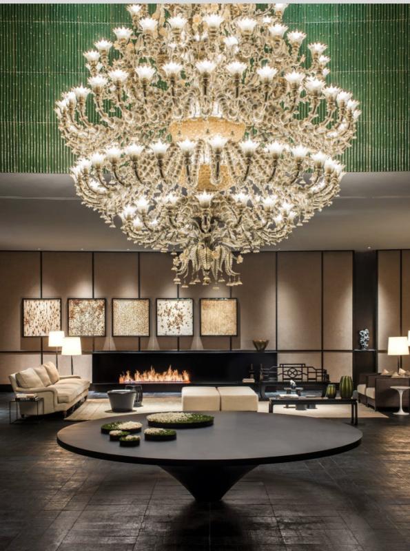 Murano chandelier installed in a luxury hospitality interior with refined architectural styling.