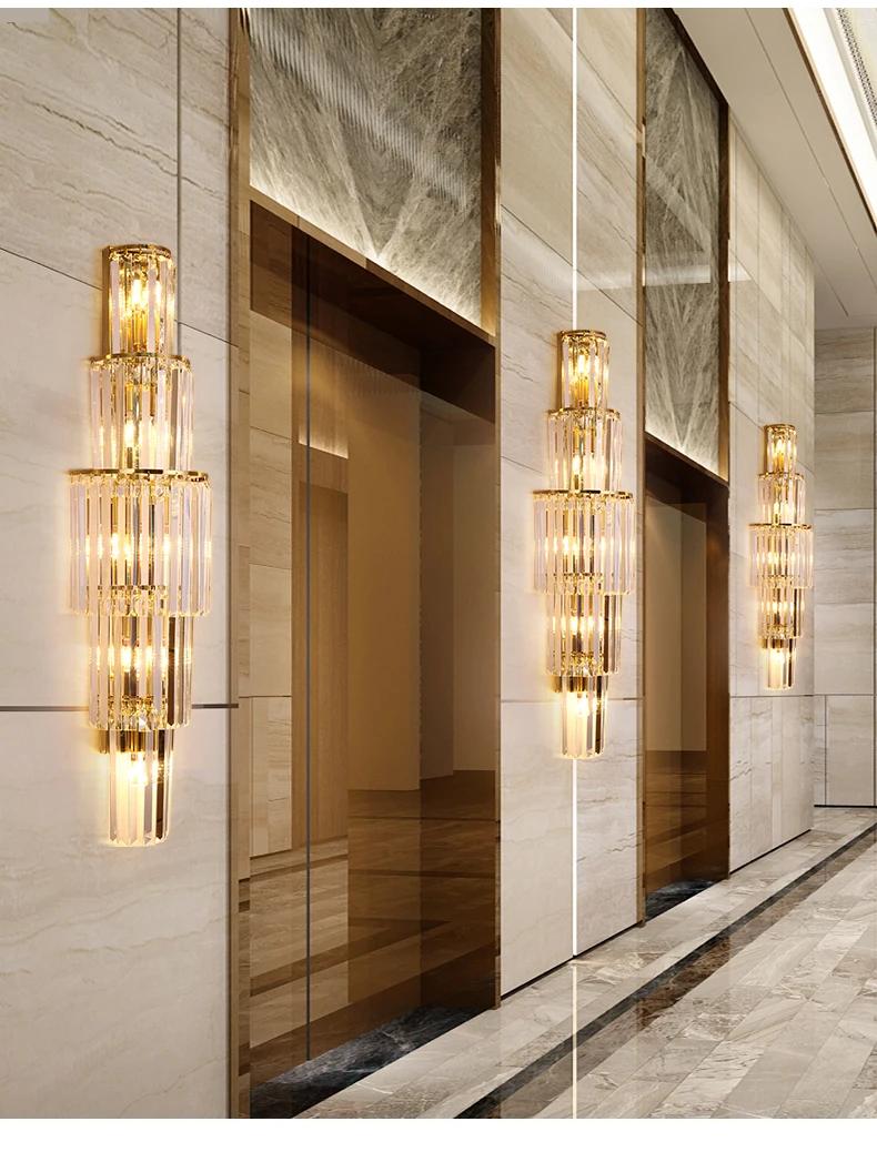 Crystal wall lamp installed in a luxury hotel lobby with refined architectural interiors.