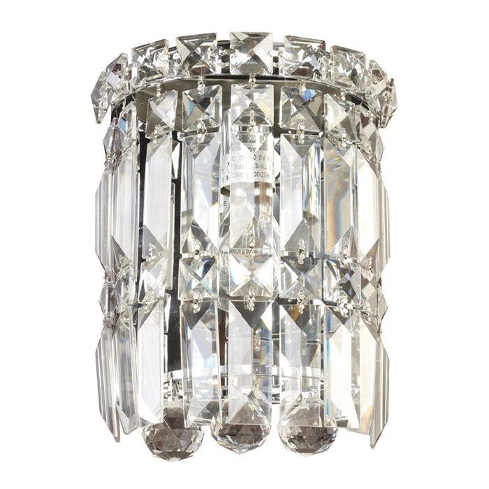 Crystal wall lamp photographed on a clean white studio background featuring precision-cut crystal elements.