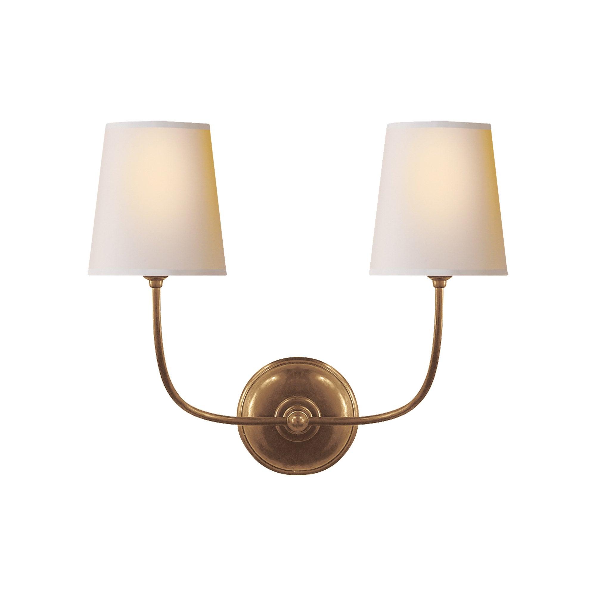 Classic wall lamp photographed on a clean white studio background featuring traditional European detailing.