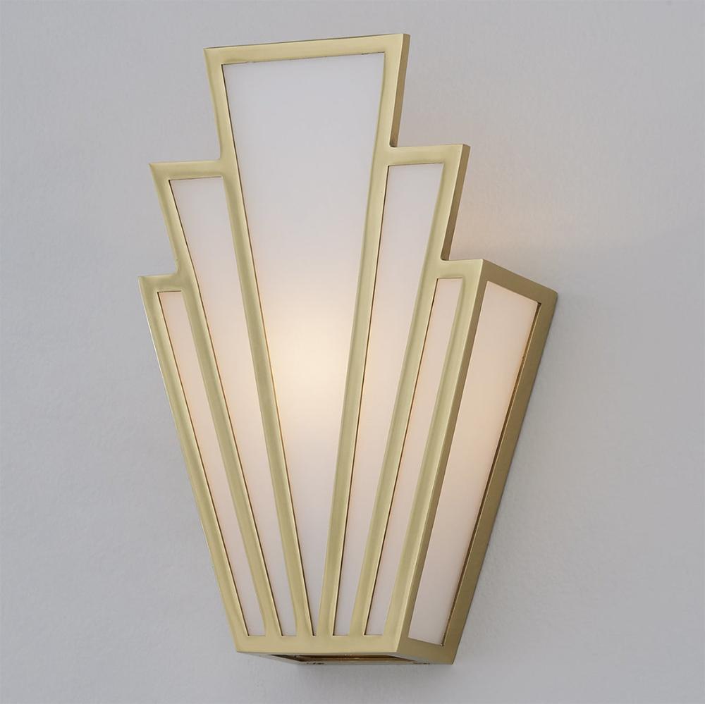 Front view of an Art Deco wall lamp with premium brass and decorative glass elements.