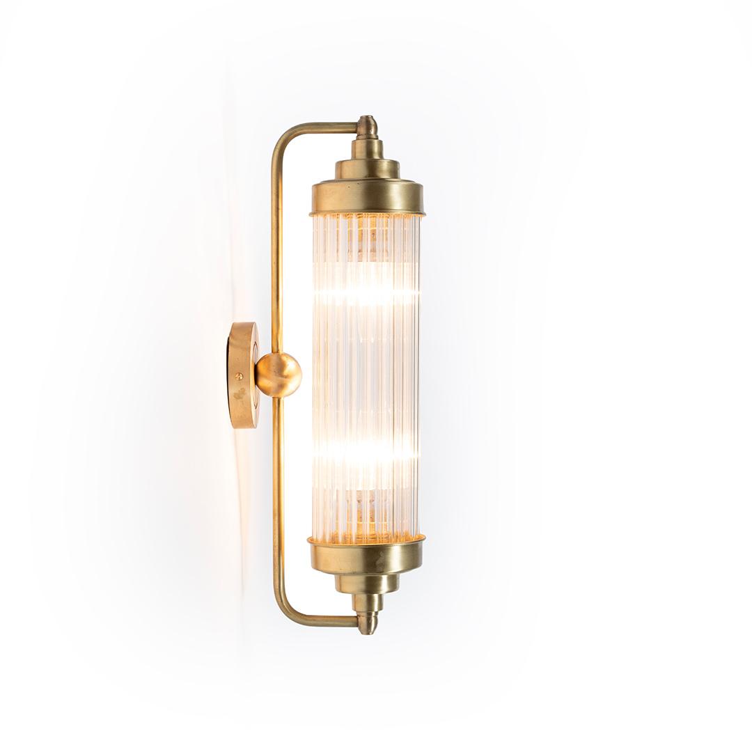 Art Deco wall lamp photographed on a clean white studio background featuring elegant geometric detailing.