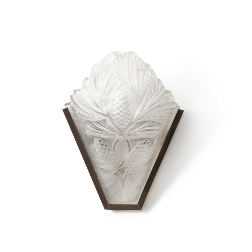 Art Deco wall lamp photographed on a clean white studio background featuring elegant geometric detailing.