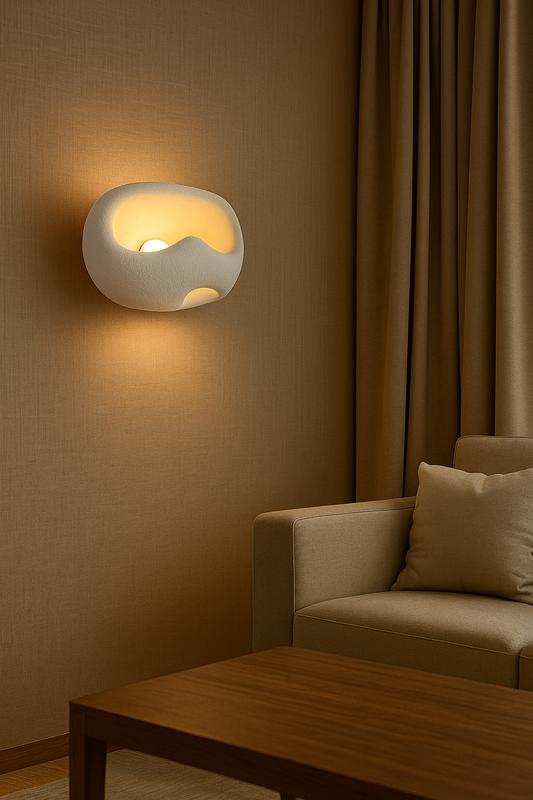 Organic wall lamp installed in a modern luxury residence with warm organic architectural styling.