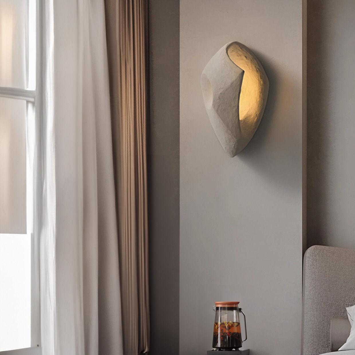 Organic wall lamp installed in a modern luxury residence with warm organic architectural styling.
