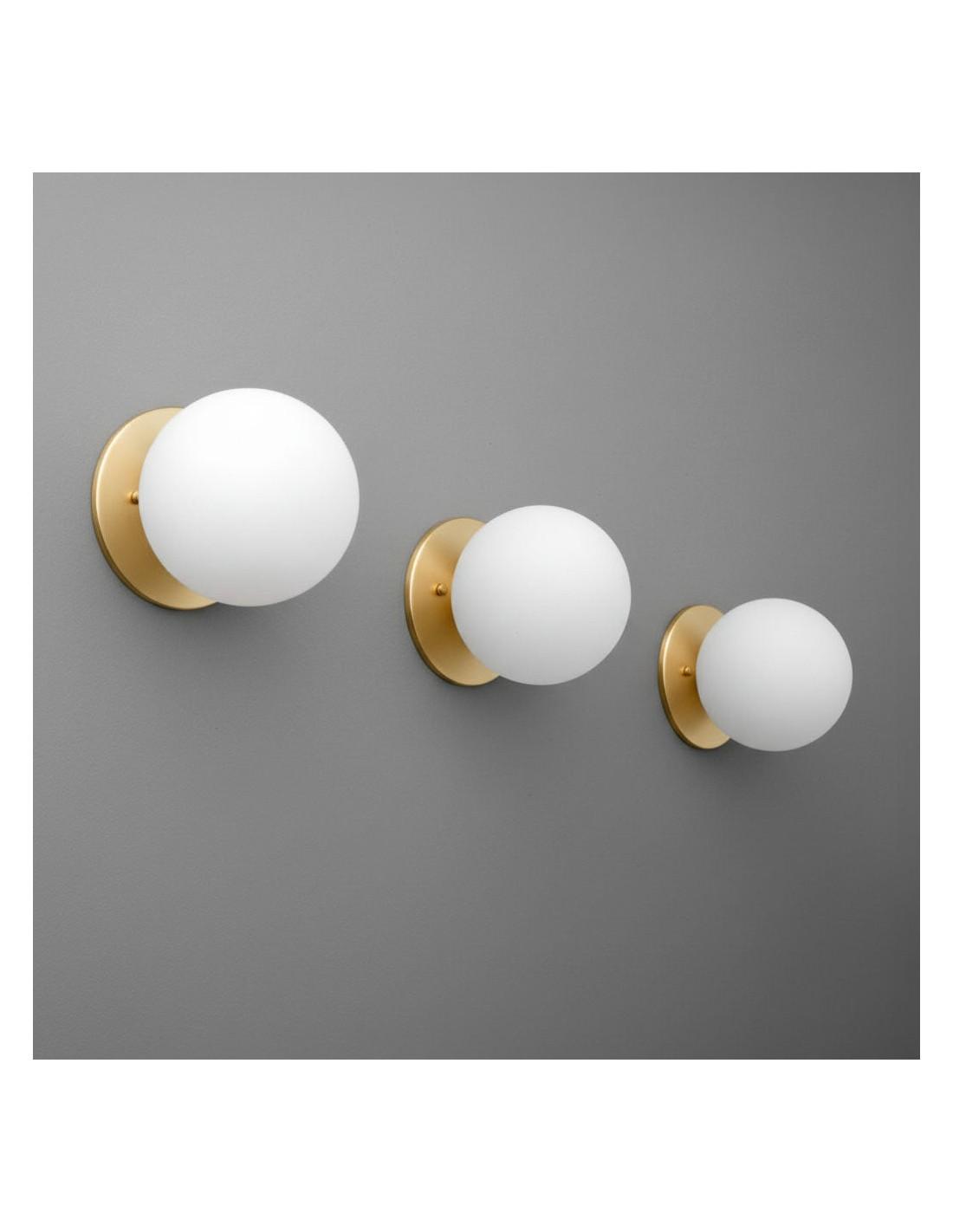 Globe wall lamp family showcasing multiple sizes, finishes and glass options.
