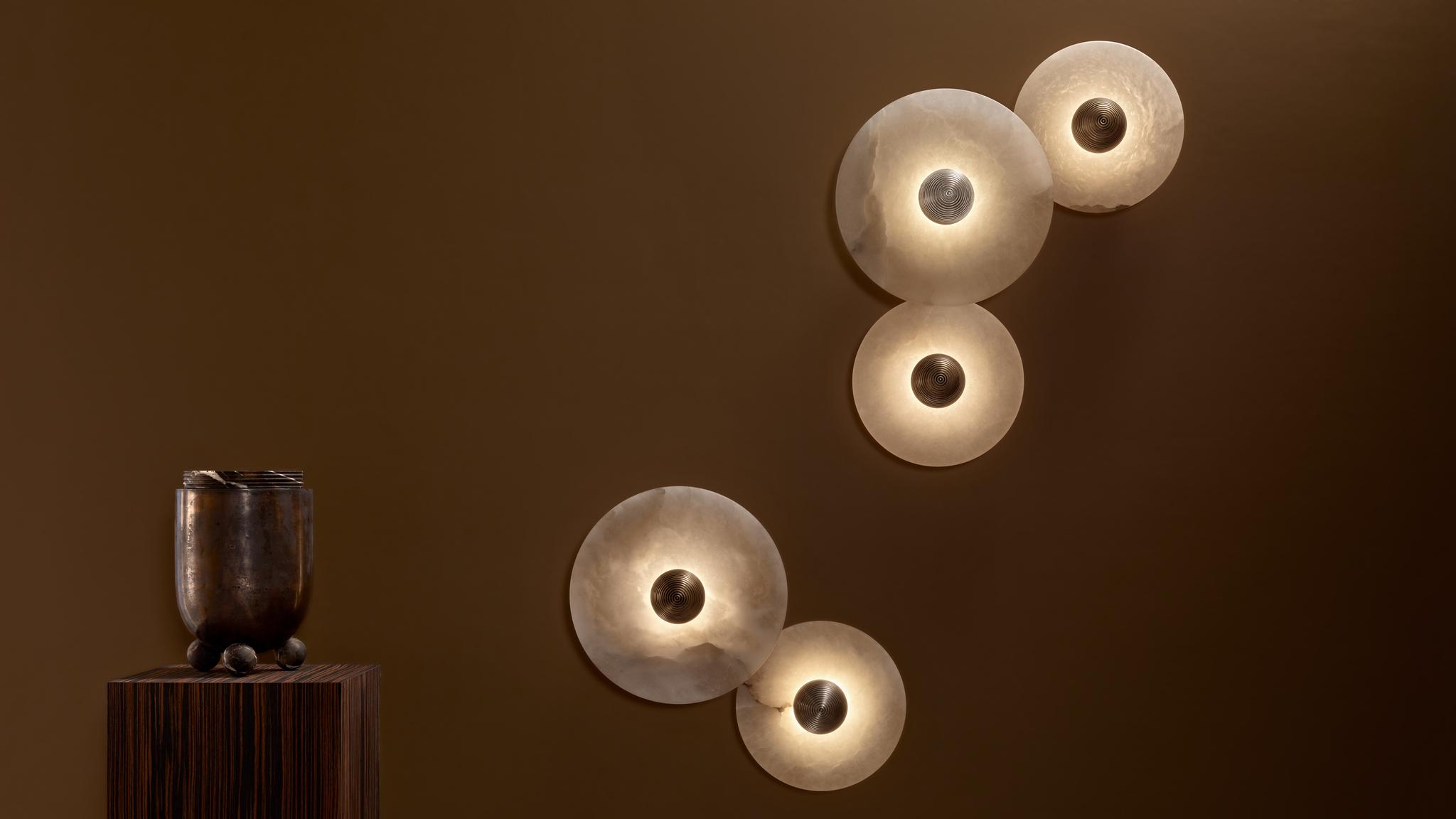 Sculptural wall lamp family showcasing artistic, geometric and organic decorative lighting collections.