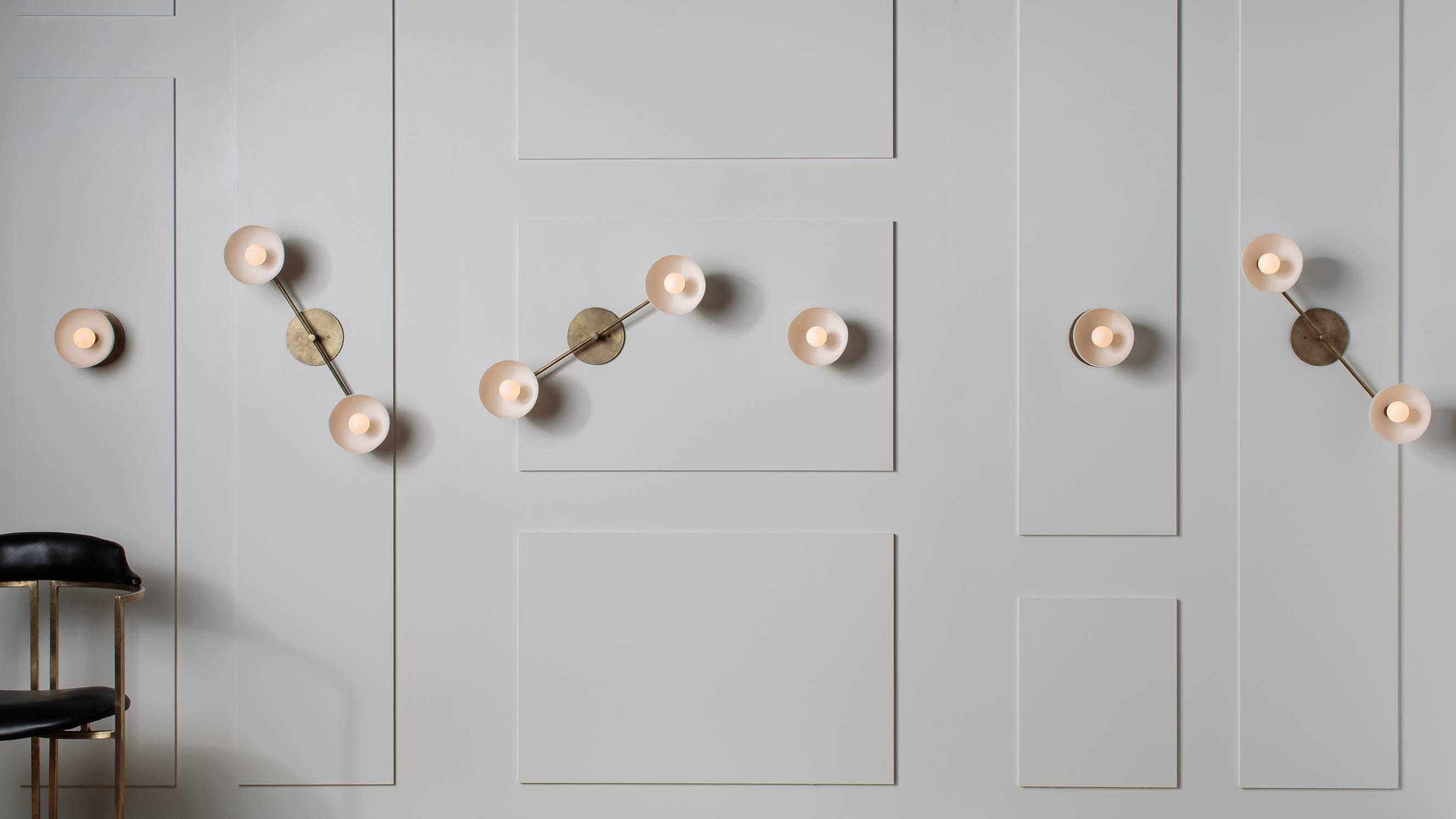 Sculptural wall lamp family showcasing artistic, geometric and organic decorative lighting collections.