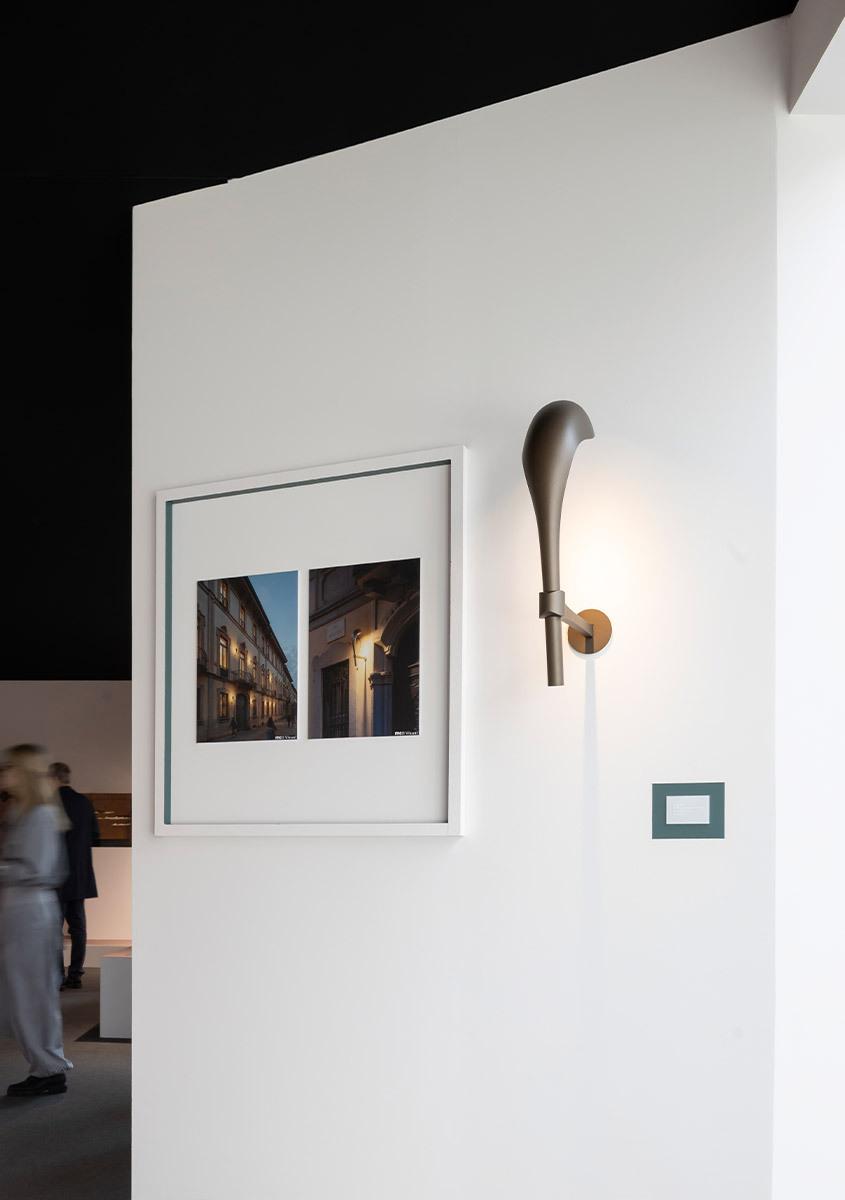 Sculptural wall lamp installed in a luxury hotel lobby creating an architectural focal point.