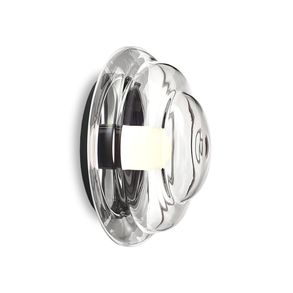 Sculptural wall lamp photographed on a clean white studio background featuring artistic architectural forms.