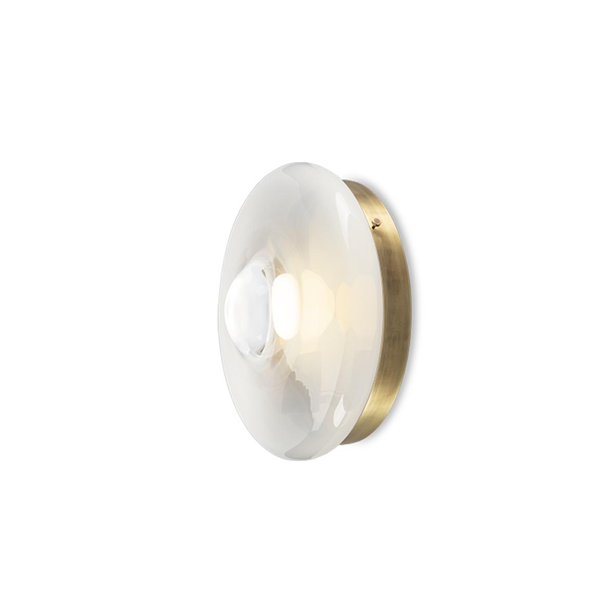 Sculptural wall lamp photographed on a clean white studio background featuring artistic architectural forms.