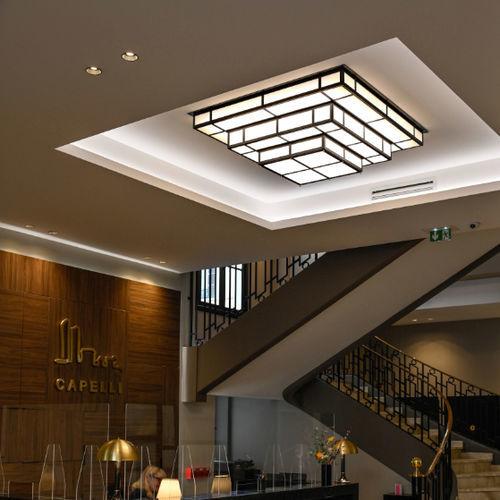 Art Deco ceiling lighting creating a distinctive atmosphere in a boutique hotel interior