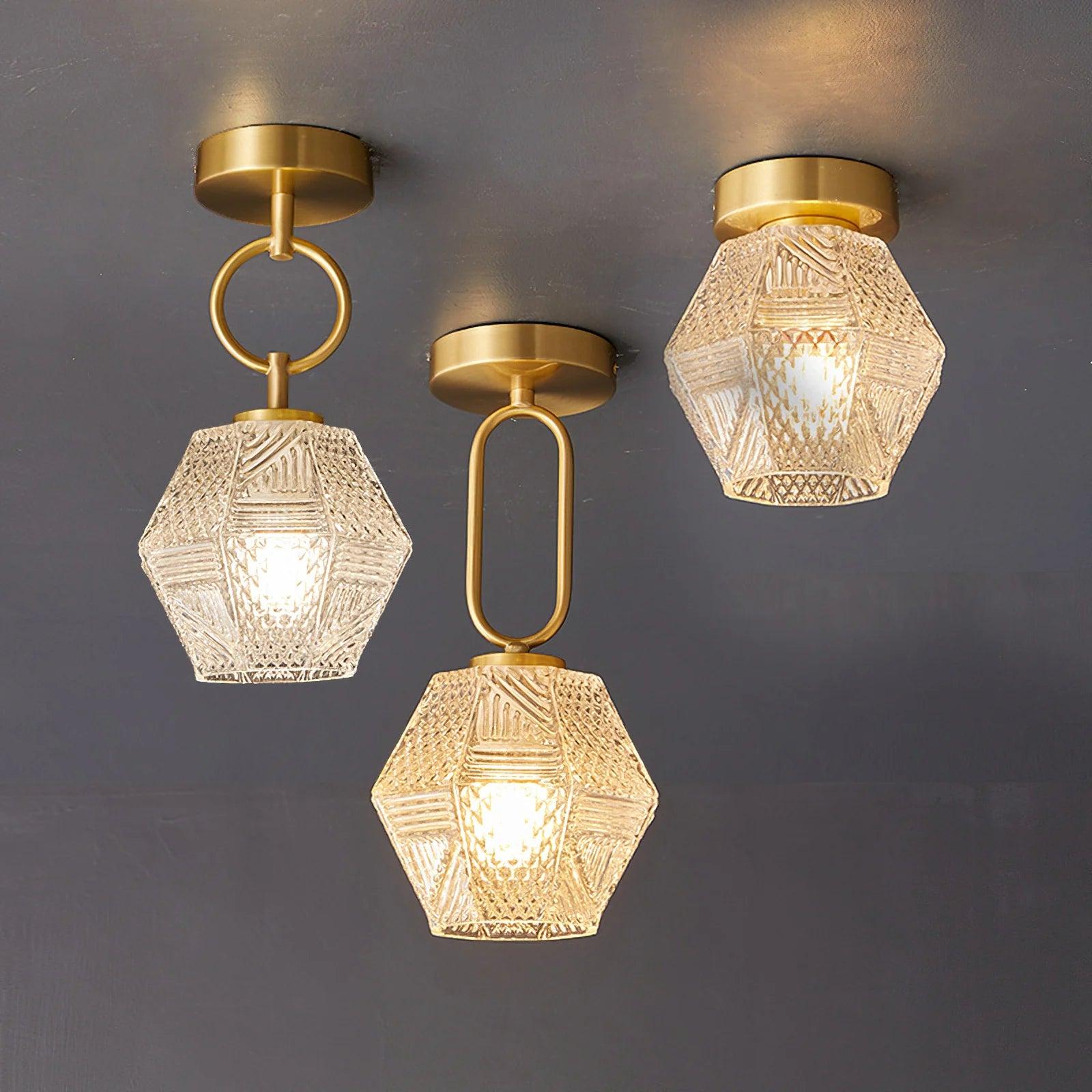 Art Deco ceiling light collection featuring different geometric brass and glass designs