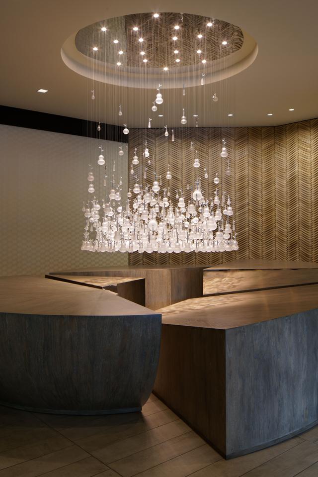 Signature lobby chandelier installed in a luxury hotel atrium.