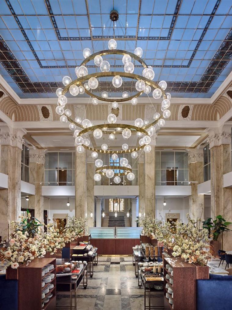 Signature lobby chandelier installed in a luxury hotel atrium.