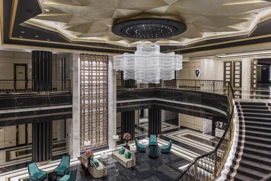 Signature lobby chandelier installed in a luxury hotel atrium.