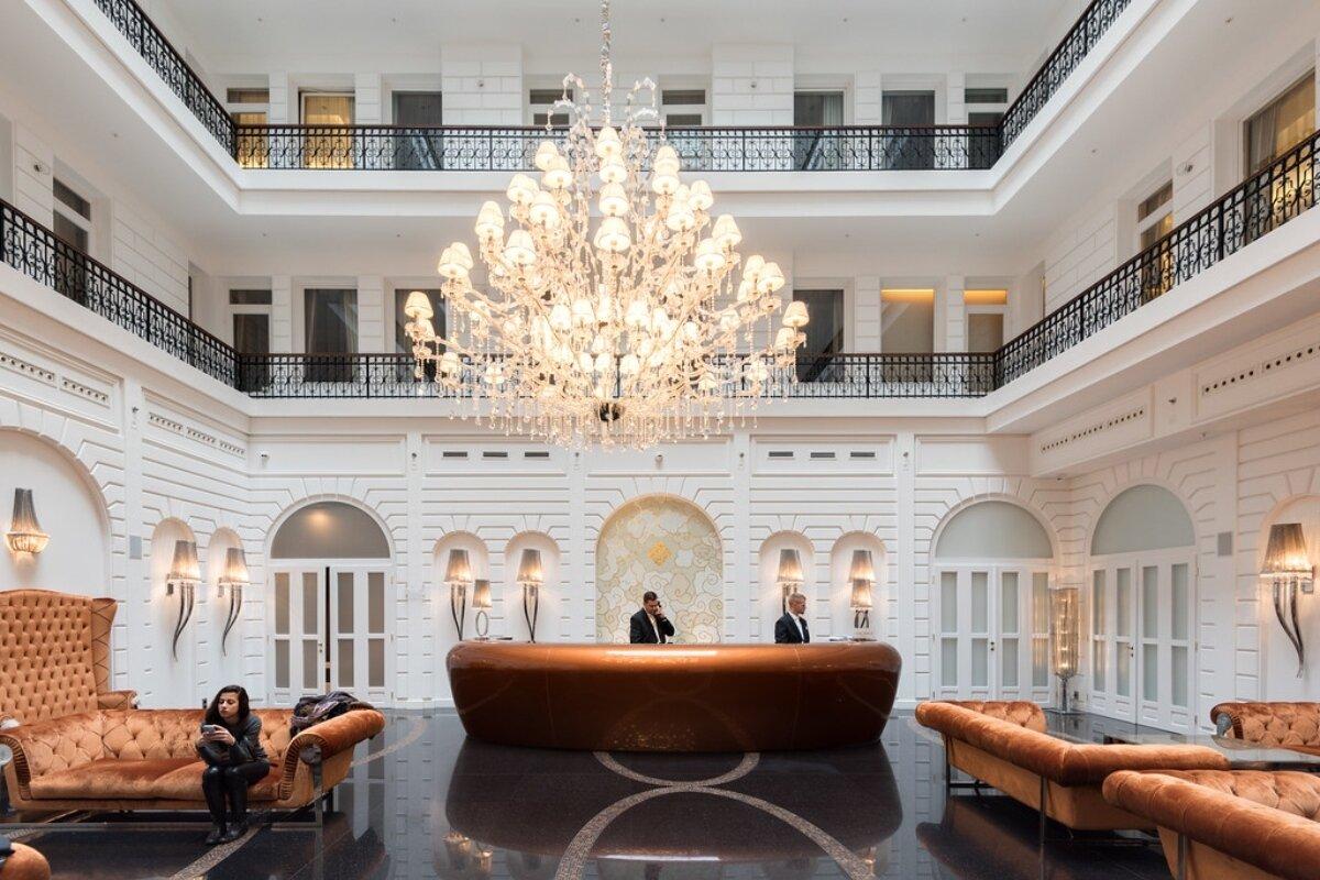 Signature lobby chandelier installed in a luxury hotel atrium.