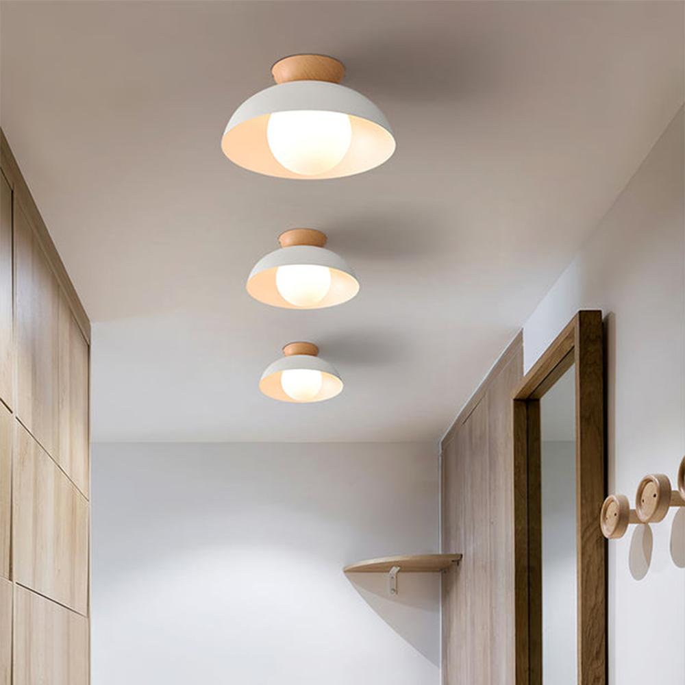 Scandinavian ceiling light collection featuring different white and light wood Nordic designs