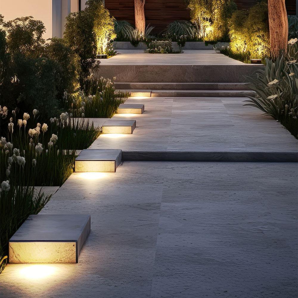 Square inground lights installed in a contemporary landscape and public space.