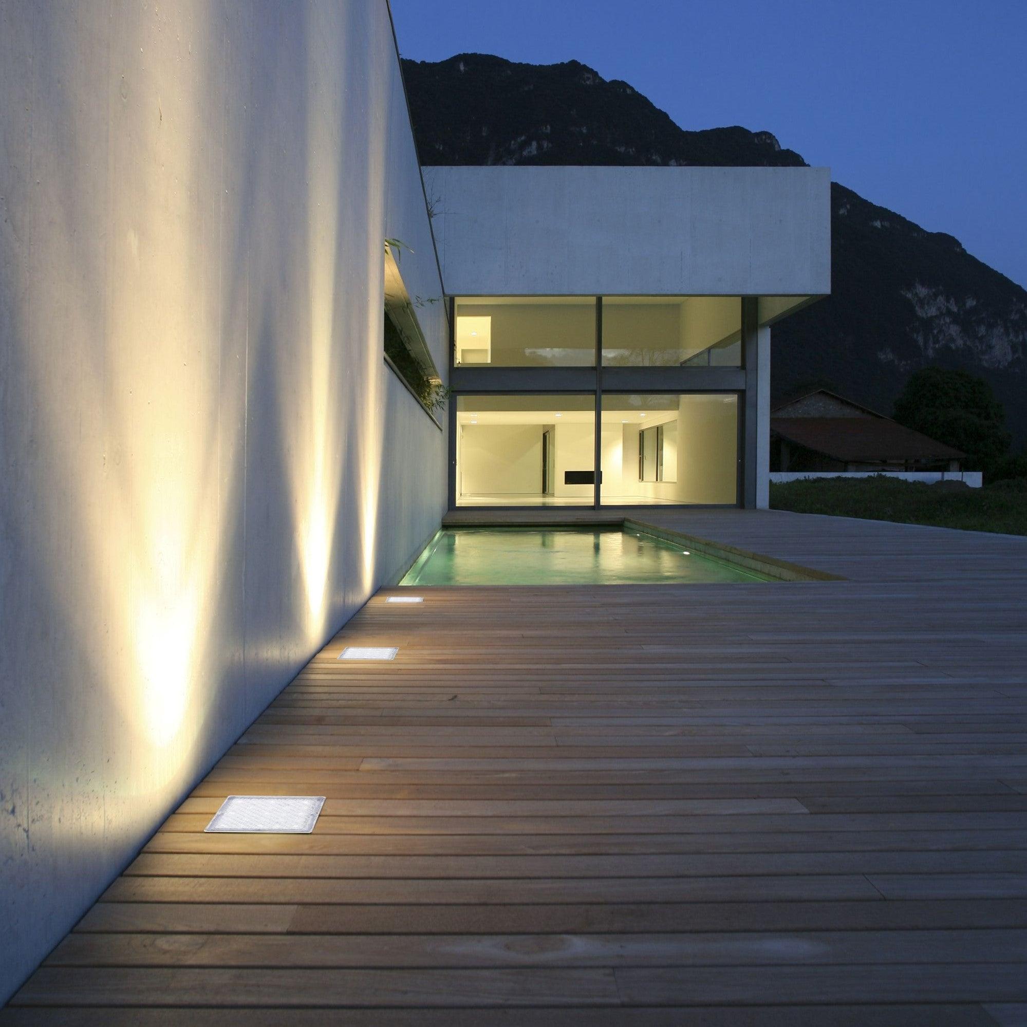 Square inground lights installed in a contemporary landscape and public space.