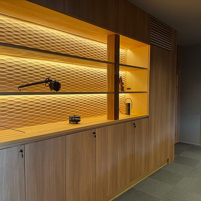 Indirect LED shelf lighting integrated into a contemporary retail display and hospitality interior.