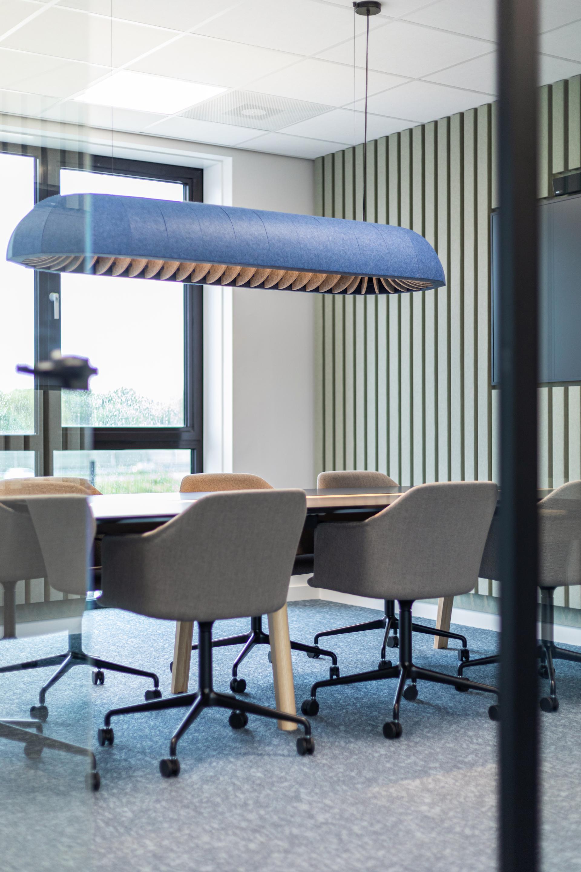 Suspended acoustic office lighting combining functional illumination with sound-absorbing elements for contemporary workplaces