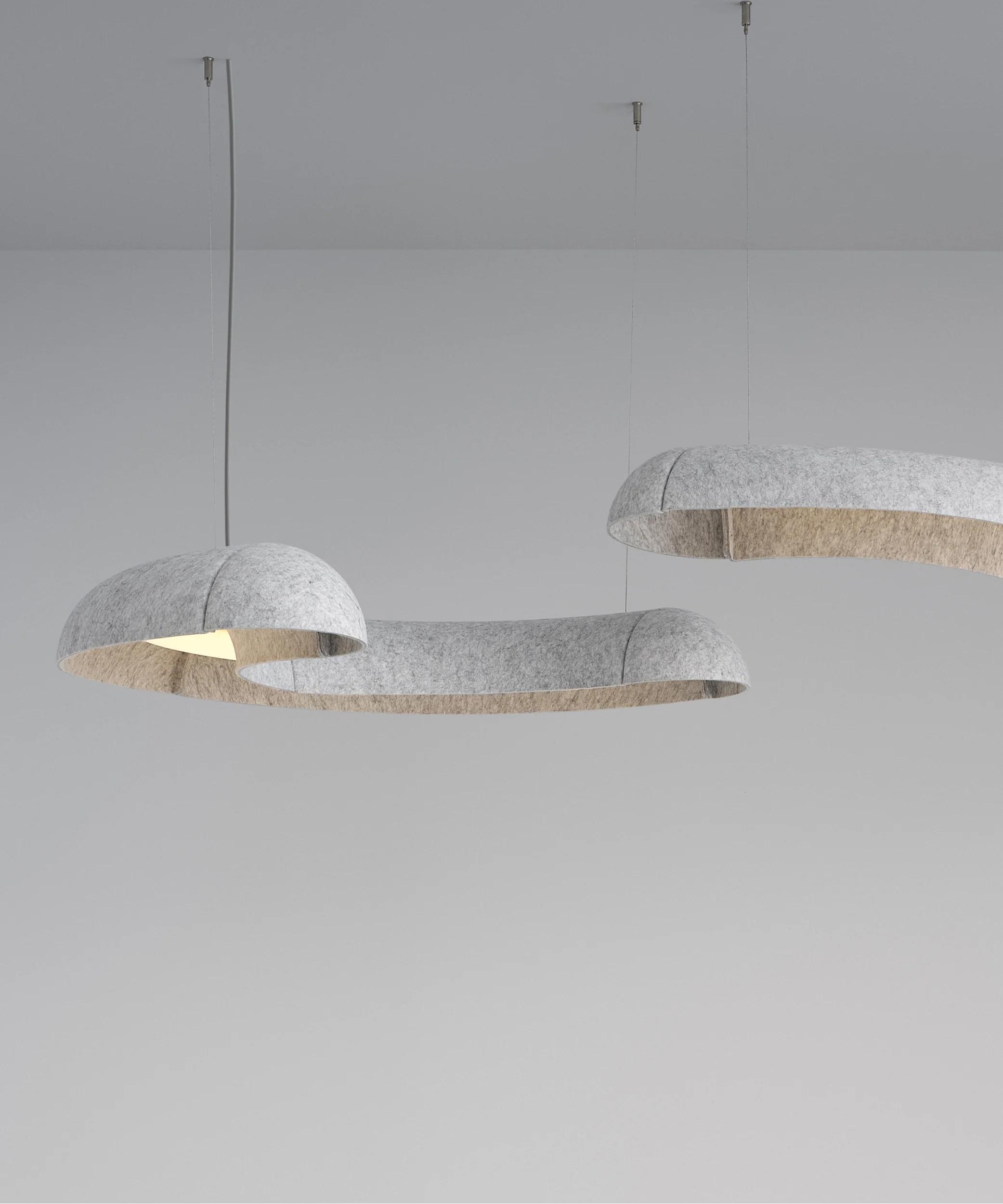 Suspended acoustic office lighting combining functional illumination with sound-absorbing elements for contemporary workplaces