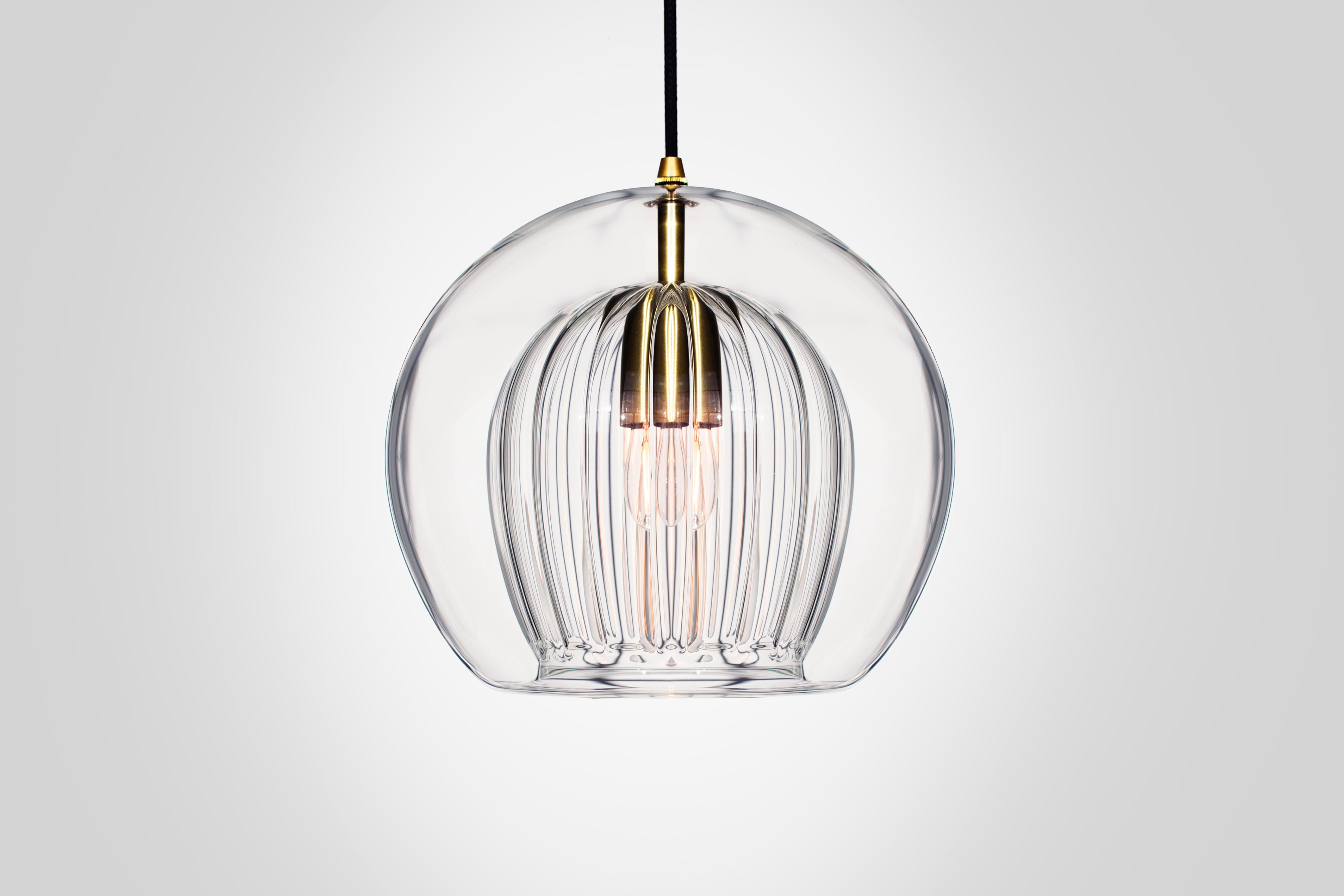 Front view of a decorative glass pendant light for architectural interiors.