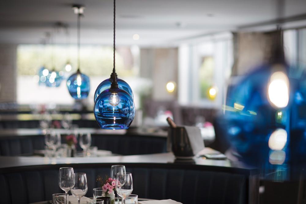 Glass pendant lighting installed in a premium hospitality interior.