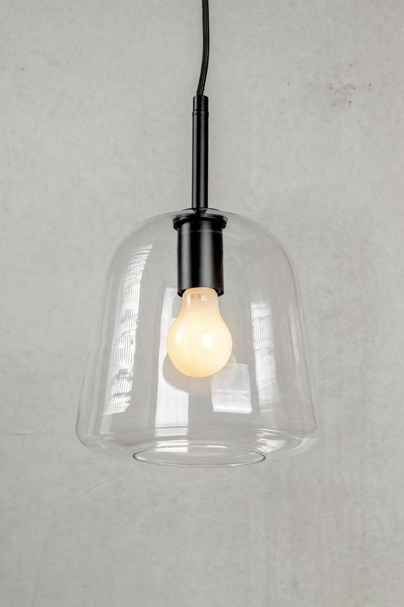 Front view of a decorative glass pendant light for architectural interiors.