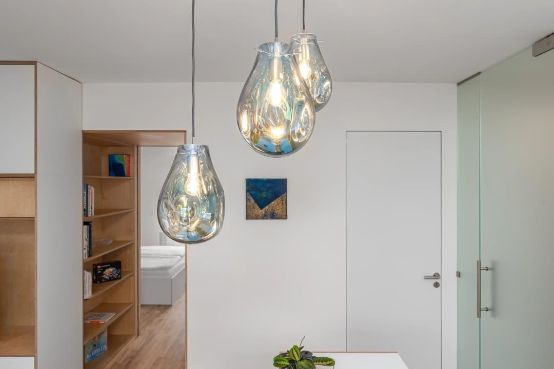 Glass pendant lighting installed in a premium hospitality interior.