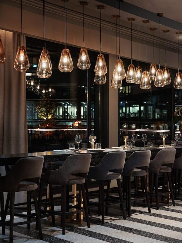 Glass pendant lighting installed in a premium hospitality interior.