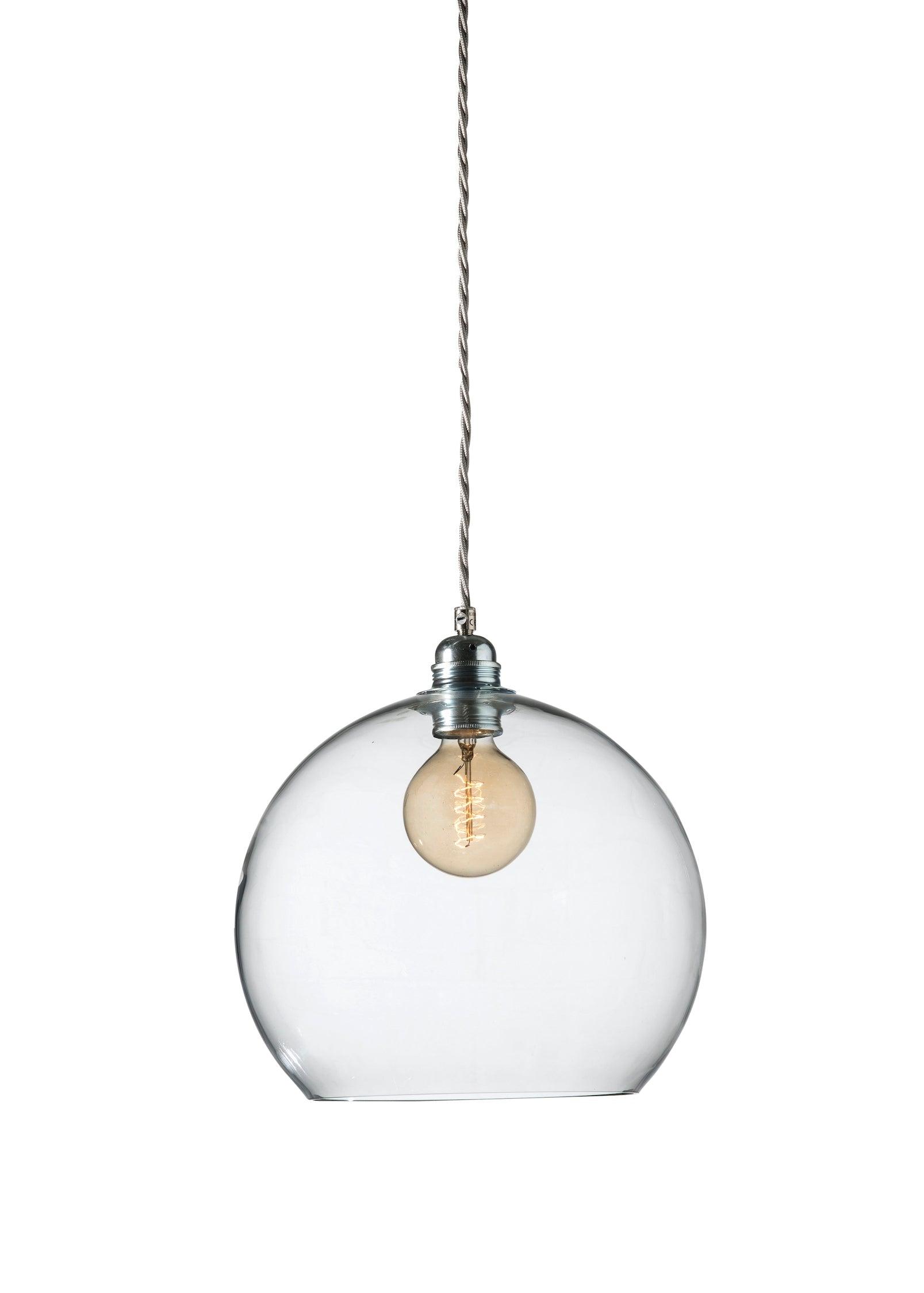 Glass pendant light photographed on a clean white studio background.