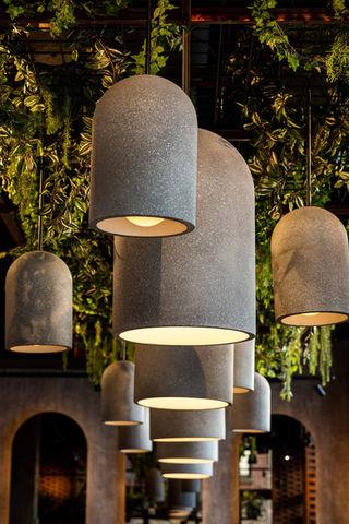 Stone pendant lighting installed in a premium hospitality interior.