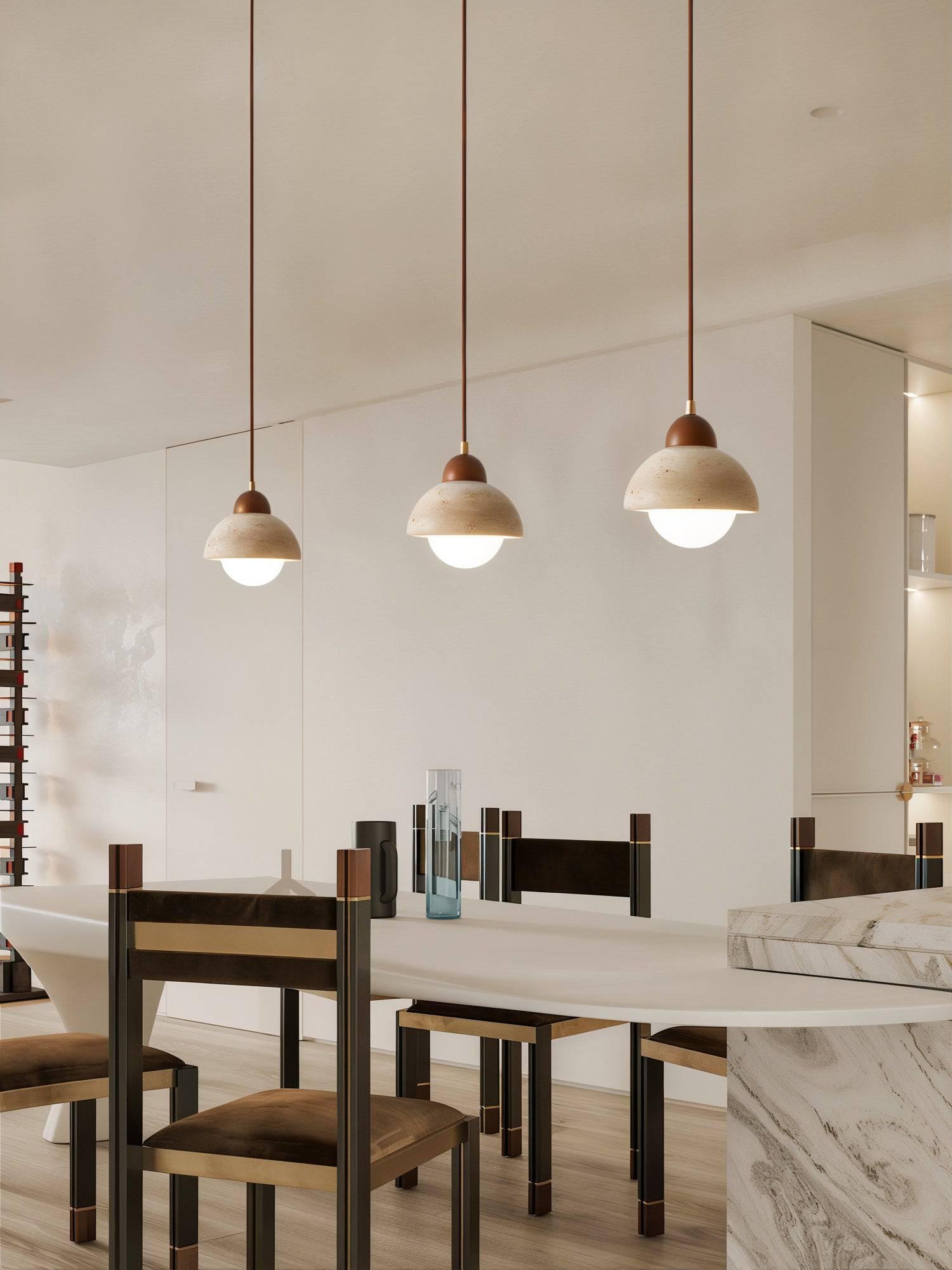 Stone pendant lighting installed in a premium hospitality interior.