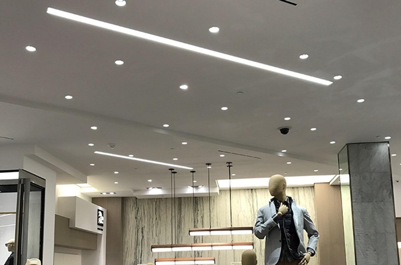 Micro recessed linear lights installed in a contemporary retail interior.
