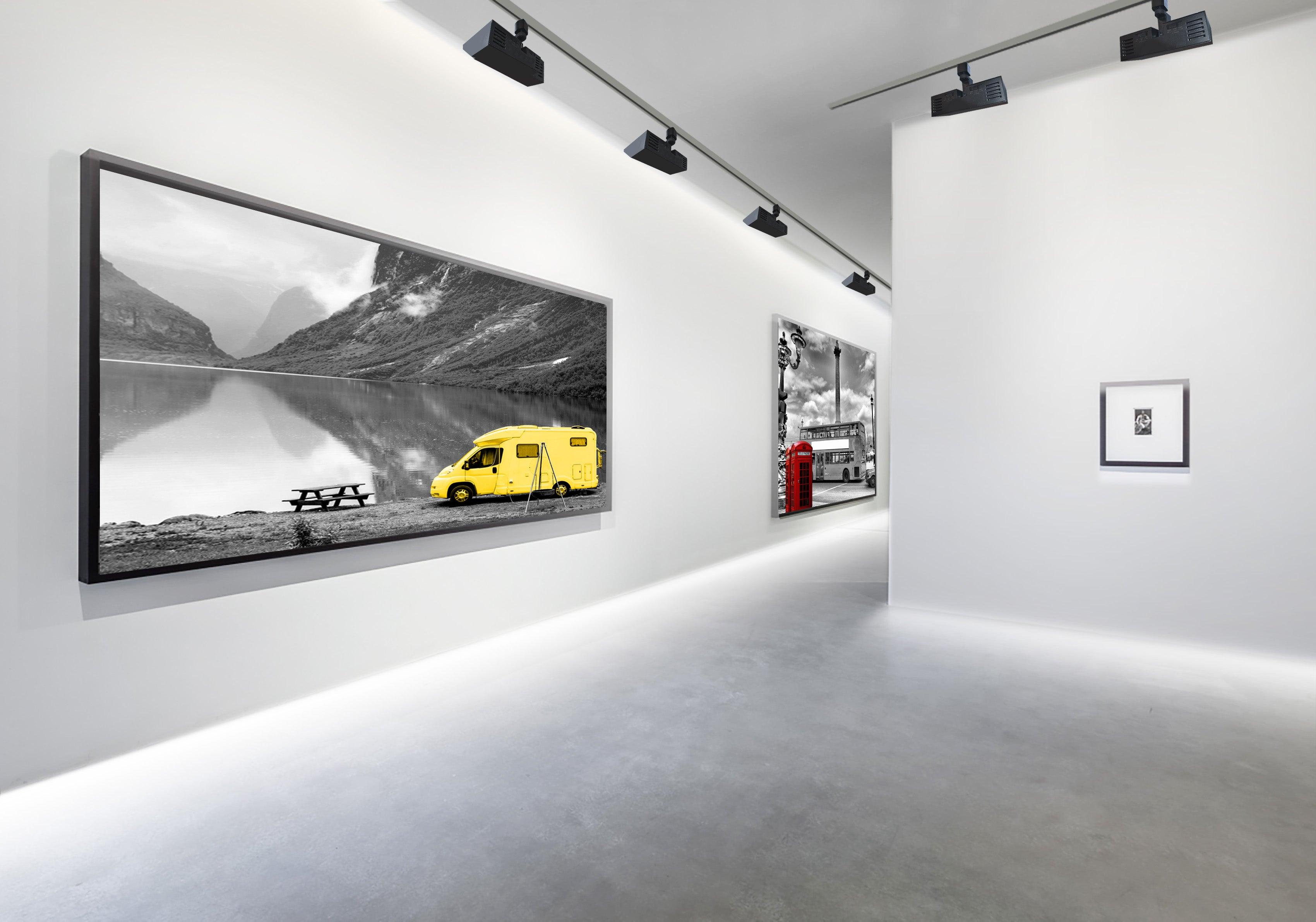Magnetic wall washer lighting illuminating gallery walls.