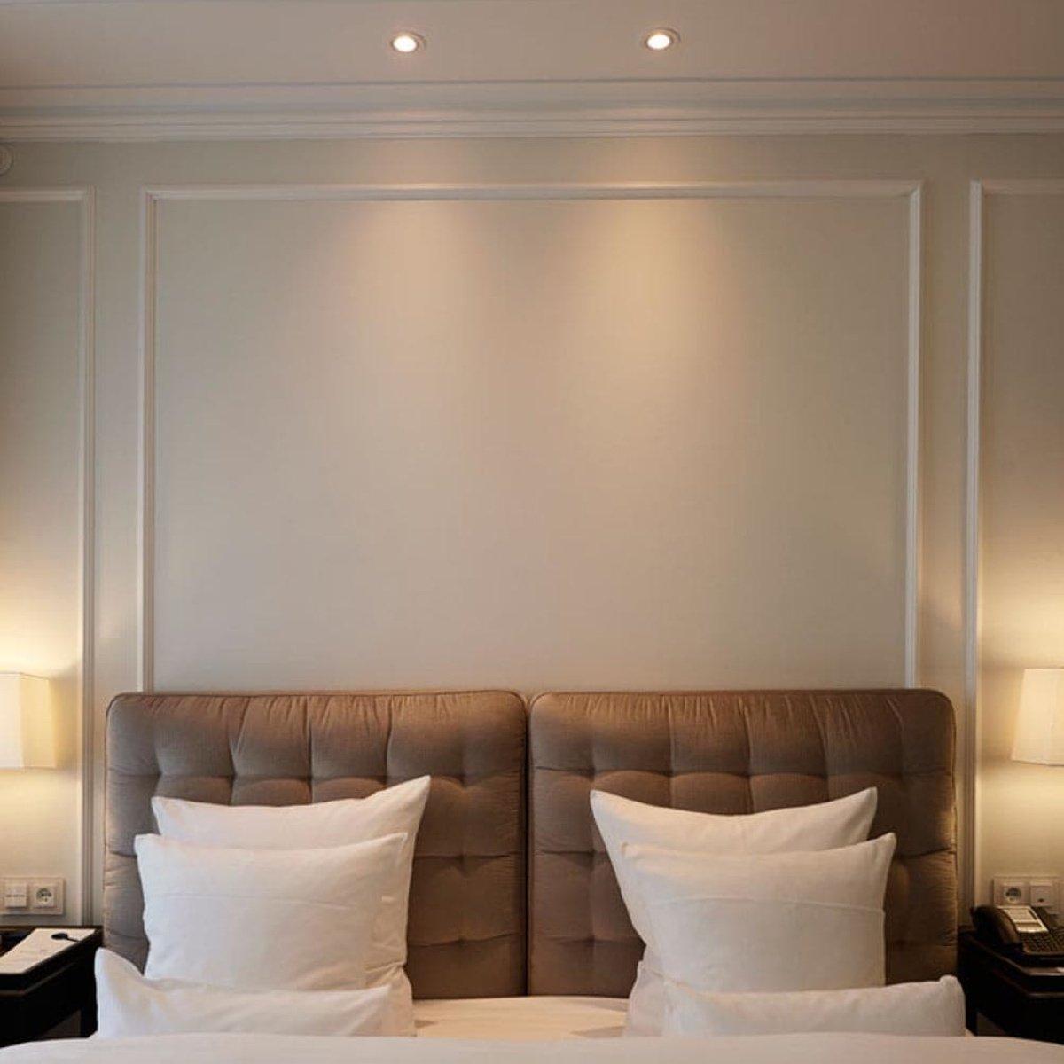 Mini recessed downlight integrated into a contemporary hospitality interior.