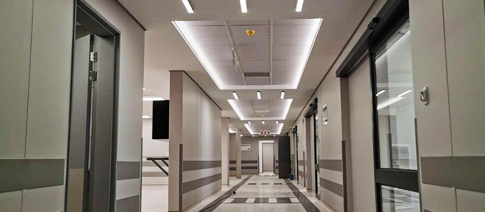Recessed panel lights installed in a contemporary hospital corridor.